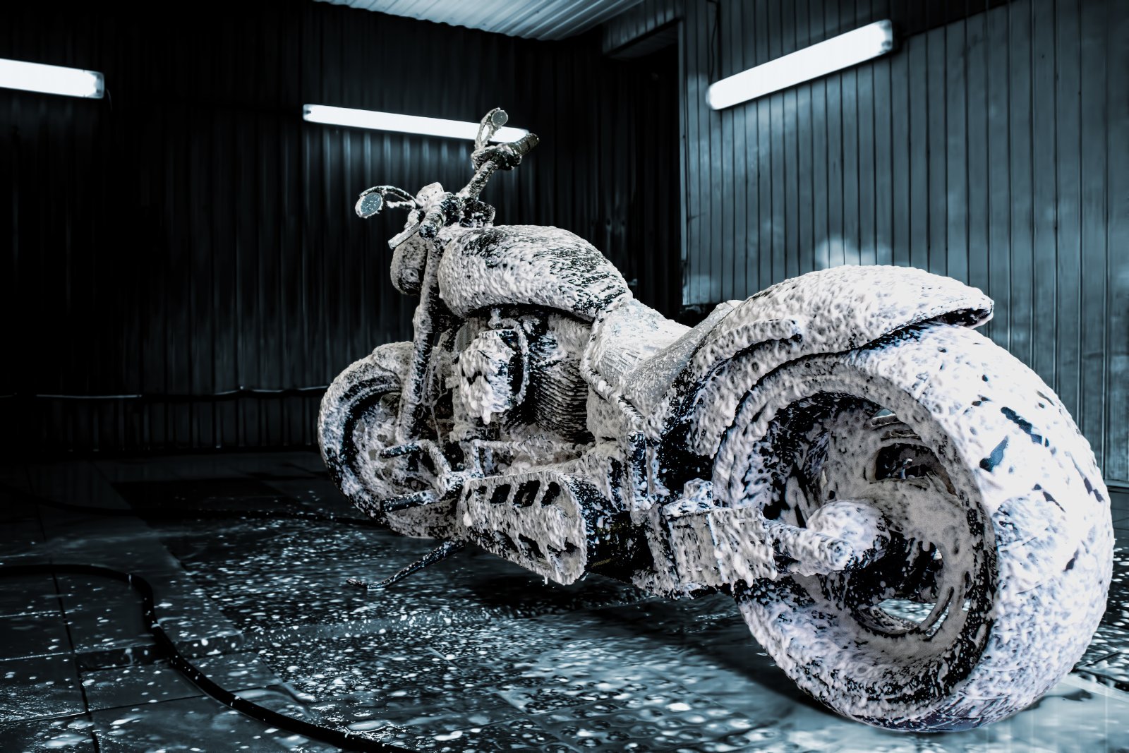 Motorcycle covered in foam during a detail